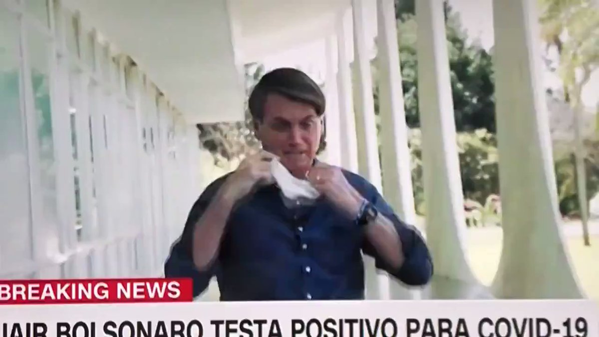 Bolsonaro, after testing positive for coronavirus, steps back and takes off mask while speaking to reporters: Just look at my face, I'm fine